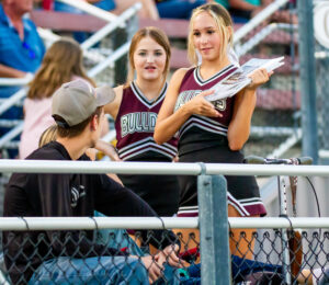 Waller Bulldog cheerleaders sell programs at a home game last season. (photo courtesy Ronin Visuals)