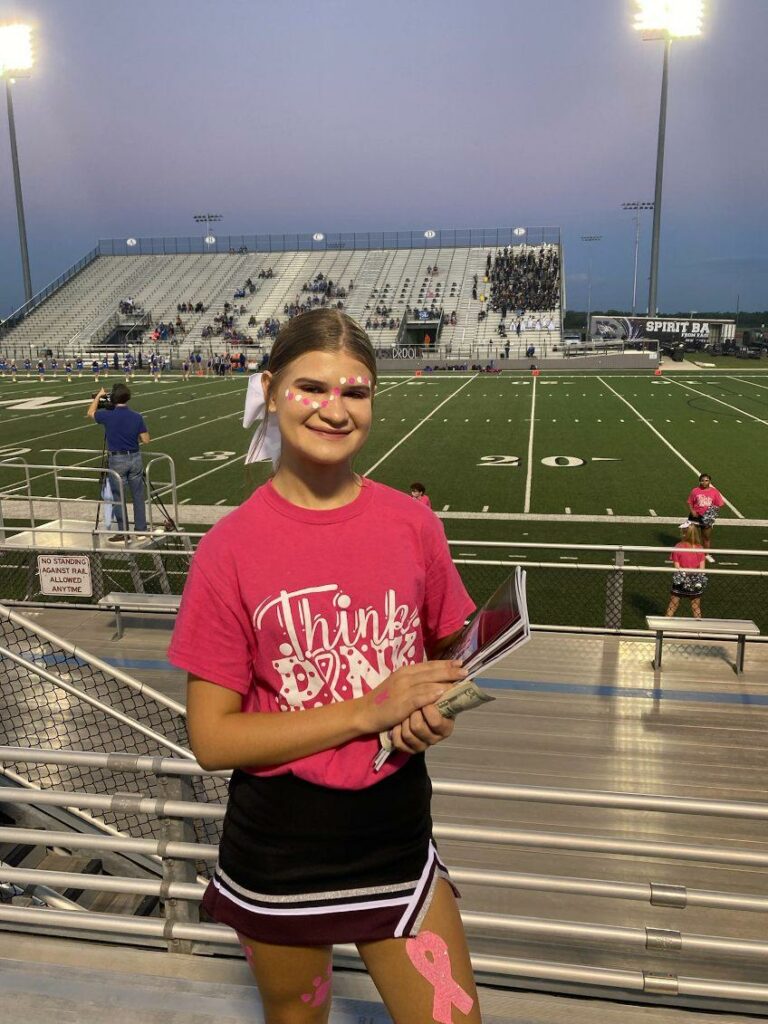 Waller Bulldog cheerleaders sell programs at a home game last season. (photo courtesy Waller Cheer Booster Club)