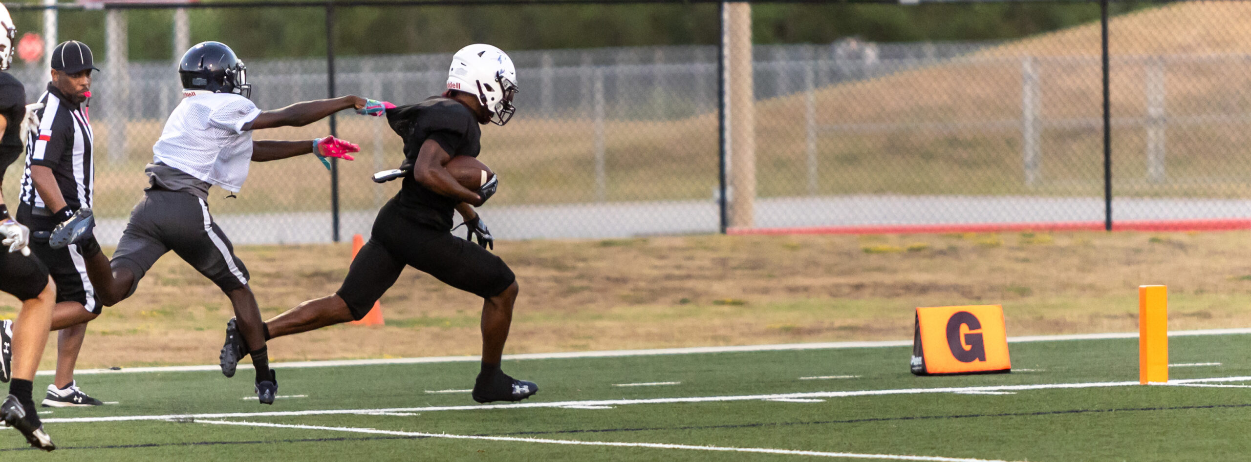 A Bulldog ball carrier breaks away and scores a touchdown from a defender during the final scrimmage of the season. The Waller Bulldogs battle Cy Ridge and Sterling High Schools in the second and final scrimmage of the season at Waller ISD Stadium, Thursday, Aug. 17, 2023. The Bulldogs are scheduled to host Bryan High School this Friday night with kickoff set for 7 p.m. in the season opener. (Photo courtesy RoninVisuals.com)