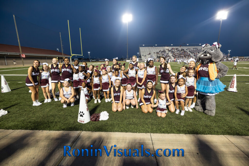 The Waller High School cheerleaders and the Waller PeeWee Football Association cheerleaders group together during the varsity football season opener Friday night. The Waller Bulldog varsity team battles the Bryan Vikings, with the 21-6 decision favoring the Vikings. The Bulldogs next game will be against Mayde Creek in Katy ISD's Legacy Stadium. (photo courtesy RoninVisuals.com)