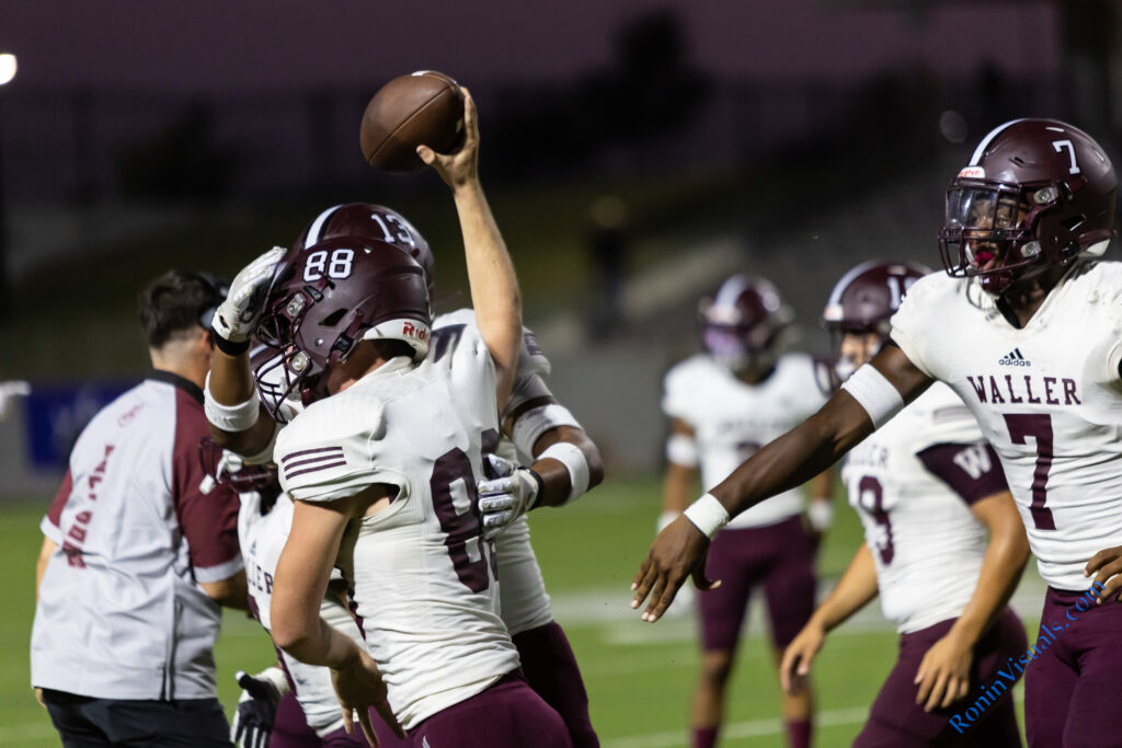 Josh Harris (88) celebrates after pouncing on a live ball after contacting a Mayde Creek player on a Bulldog punt during the second game of the year. With him are Joe Reyna (13, obscured), Thony Tshitenge (7) and other Waller players. The Waller Bulldogs broke their losing streak with a victory over Katy Mayde Creek’s Rams, 35-0, at Legacy Stadium, Saturday, Sept. 2, 2023. (Photo courtesy RoninVisuals.com)