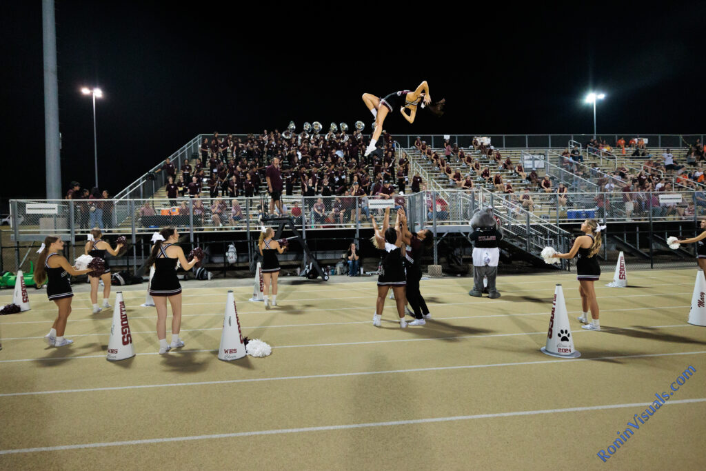 Cheer captain Natalie Barish poses midair during the third game of the football season. The Waller Bulldogs got a reality check from one of the top ranked teams in Texas, the Montgomery Lake Creek Lions with a 63-24 decision at Montgomery ISD Athletics Complex, Friday, Sept. 8, 2023. (Photo courtesy RoninVisuals.com)