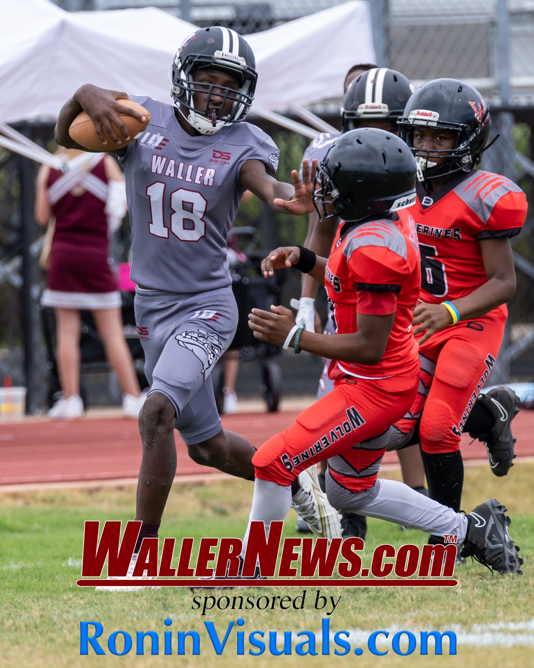 Makhy Adams keeps the football from a Walker County Wolverine defender during the 12U game. The Waller Elite PeeWee football players defeat the Walker County Wolverines, 7-6, at Schultz Stadium at Holleman Elementary School, Saturday, Sept. 9, 2023. (Photo courtesy RoninVisuals.com)
