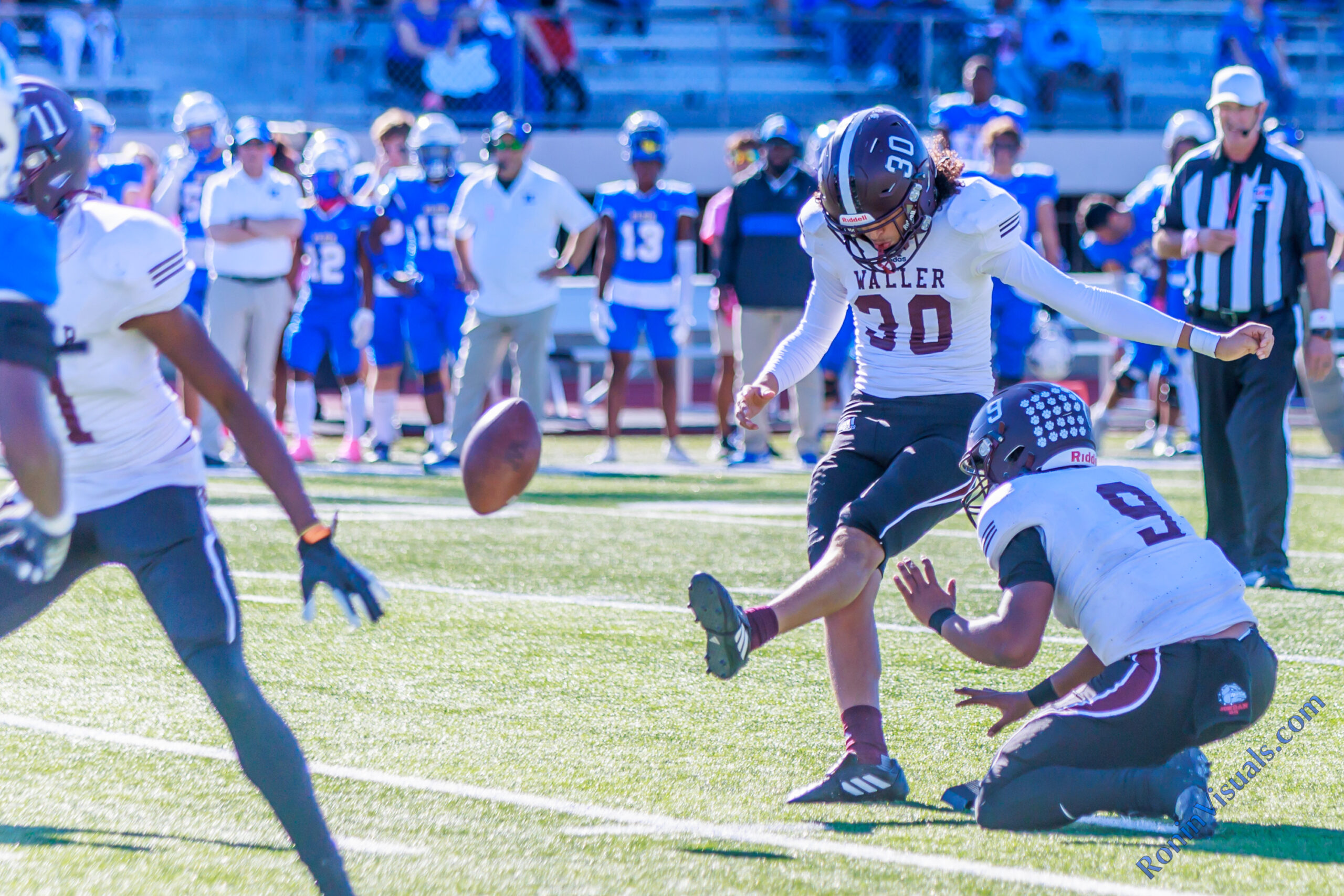 Joevan Ortiz (30) kicks a field goal during the Bulldogs' second win of the season, while quarterback Jordan Duncan (9) works as the placeholder. The Waller varsity Bulldogs defeat Klein for the team’s first ever district victory in Class 6A, 38-21, at Klein Memorial Stadium on Saturday, Oct. 14, 2023. (Photo courtesy RoninVisuals.com)